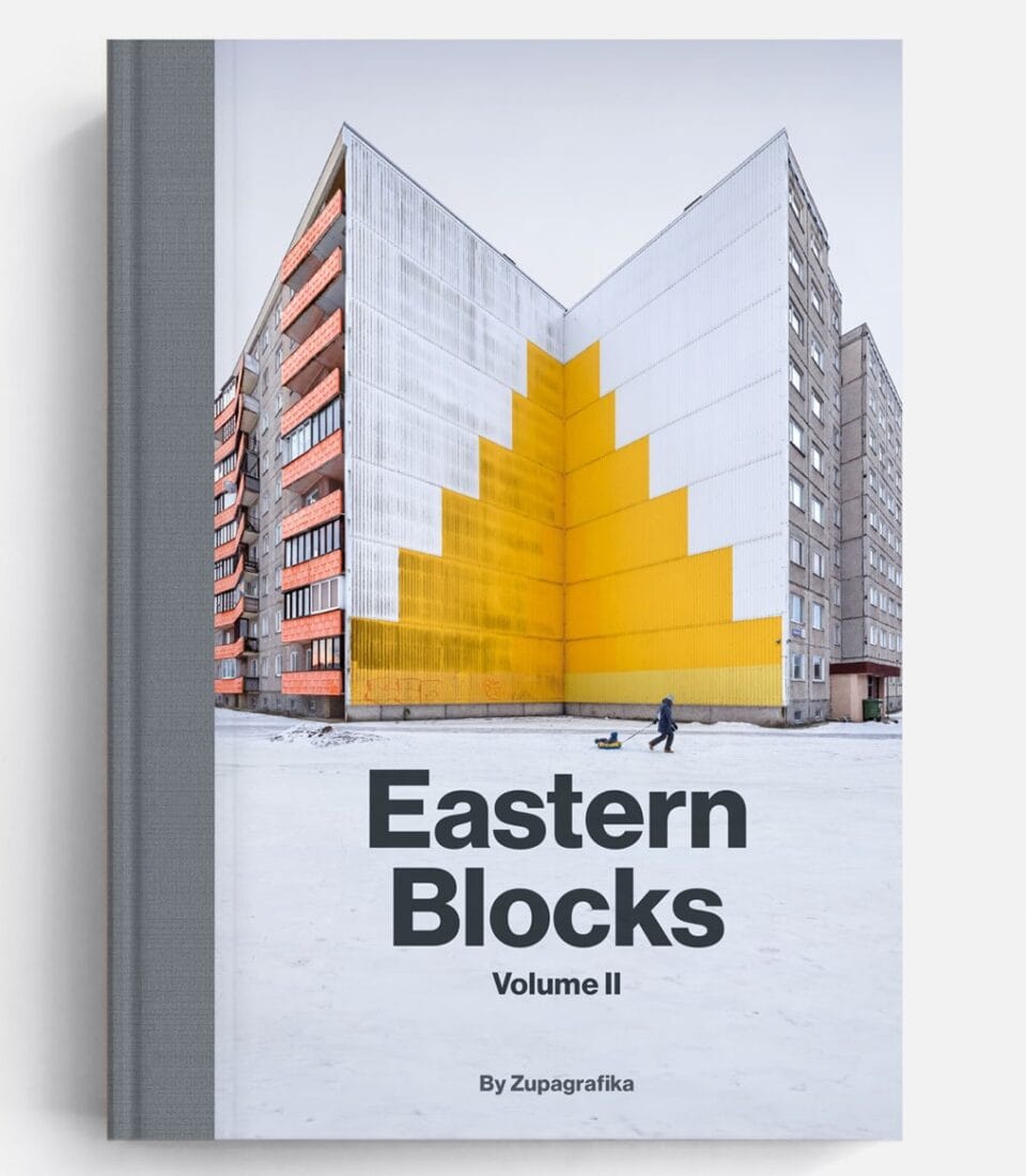 cover of the book 'Eastern Blocks Volume II," showing a Soviet-era brutalist building with a yellow stepped motif painted into a corner