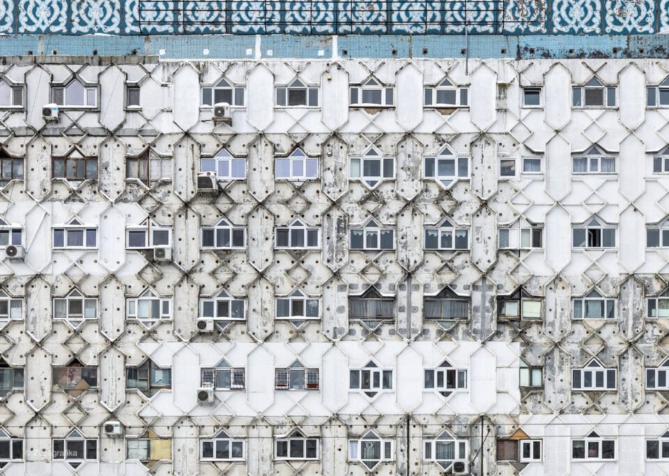 a photograph of windows in a large Soviet-era residential building