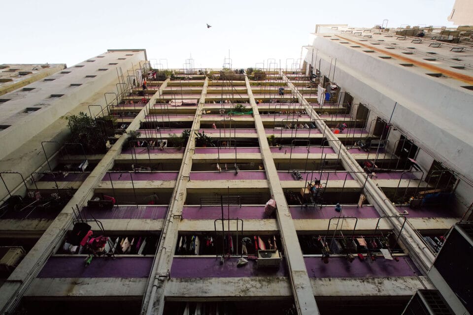 a purple and white building viewed from the ground